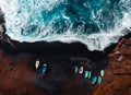 Horizontal aerial photo of black sand volcanic beach with boats on the shore and big and strong waves in ocean -  Lanzarote, Royalty Free Stock Photo