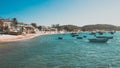 Horizontal aerial shot of a Rio de Janeiro beach with houses on it and many boats in the sea Royalty Free Stock Photo