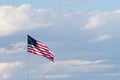 Horizontal American Flag Against a Cloudly Sky. Flag is unfurle Royalty Free Stock Photo