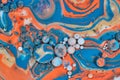 Horizontal background asset of abstract swirls of orange blue white and gold egg spheres