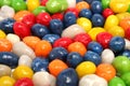 Horizontal background made of multi-coloured sweets with raisin