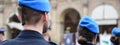 Horizontal banner or header with some soldiers in blue uniform of the Italian army including women in Bologna, Italy