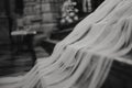 Horizontal black-and-white shot of a wedding veil on stairs Royalty Free Stock Photo