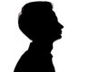 Horizontal black and white silhouette portrait of an unrecognizable guy thoughtfully looking up,young man face profile on a white Royalty Free Stock Photo