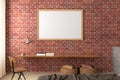 Horizontal blank poster frame mock up on the red brick wall in interior of loft bedroom Royalty Free Stock Photo