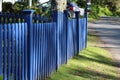 Horizontal blue picket fence with posts