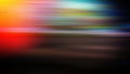 Horizontal blurred lines orange, green, brown, pink, red, yellow, blue.