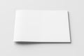 Horizontal brochure or booklet cover mock up on white. Isolated with clipping path around brochure. Front view. Royalty Free Stock Photo