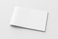 Horizontal brochure or booklet cover mock up on white. Isolated with clipping path around brochure. Side view. Royalty Free Stock Photo