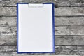 Horizontal clipboard with blank white paper on wooden Royalty Free Stock Photo
