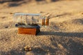 Miniature souvenir of a vintage three-masted sailboat in a small glass bottle