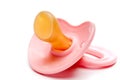 A horizontal close-up of a pink baby pacifier Royalty Free Stock Photo