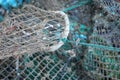 Horizontal closeup detail of weathered prawn trap on a dock in western Scotland