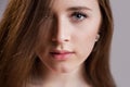 Horizontal closeup portrait of a beautiful young woman with clean skin, long eyelashes and natural beauty, fresh face Royalty Free Stock Photo