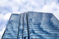 Horizontal closeup view of the gleaming blue glass facade of the Hartford Center - 100 Pearl