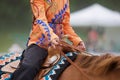 Western Rider in Sparkly, Orange Blouse