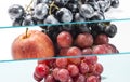 Horizontal collage of photos of fresh grapes and apples .