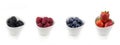 Horizontal collection of berries in bowls