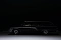 Side view of a black vintage station wagon luxury car