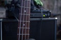 horizontal detail of the fret board of a bass guitar on amp background