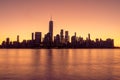 Horizontal early morning view of the New York City skyline at sunrise, with golden reflections Royalty Free Stock Photo