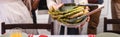 Horizontal of elderly woman holding bowl