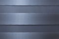 Horizontal fabric gray-blue blinds. Close-up. Modern trends in decoration and interior design. Front view. Space for text Royalty Free Stock Photo