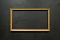 Horizontal gold thin picture frame on black Royalty Free Stock Photo
