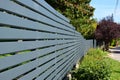 Horizontal gray metal fence in diminishing perspective. Royalty Free Stock Photo