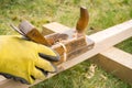 Horizontal high angle angle studio shot of small vintage old wood planer Royalty Free Stock Photo