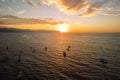 Horizontal idyllic sunset view as seen from an aerial view near Los Muertos Beach Pier in the sky