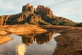 Horizontal image of cathedral rock seen from secret slickrock with reflection of geological sandstone rock formations and spires