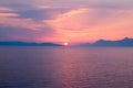 Sunset over the sea with hazy blue and golden hues Royalty Free Stock Photo