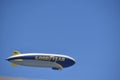 Horizontal image of the Goodyear Blimp against a clear blue sky