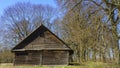 Horizontal image of an old rustic abandoned house and trees. Countryside concept Royalty Free Stock Photo