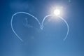 Air planes in process of making heart shape in sky