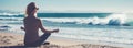 Horizontal image rear view young blond woman sitting in lotus position folded fingers mudra gesture meditating on the beach