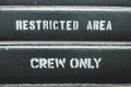 Horizontal image of a restricted area sign, only crew