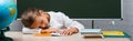 Horizontal image of tired schoolgirl sleeping Royalty Free Stock Photo