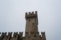 Horizontal image of the tower of Scaligero Castle in Sirmione on a cold and gray winter day. Royalty Free Stock Photo