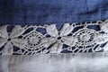 Horizontal lacy stripe on blue linen fabric Royalty Free Stock Photo