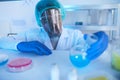 Male Scientist Looking At Liquid In Flask Royalty Free Stock Photo