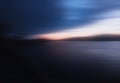 Horizontal motion blur sunset on river background