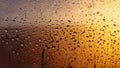 Horizontal natural background with water drops on the window with sunbeams, condensation on the glass with dripping drops Royalty Free Stock Photo