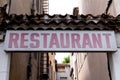 Horizontal old white ancient signage on shop restaurant front