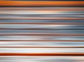 Horizontal orange and grey motion blur background