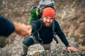 Horizontal outdoors image of traveler bearded man trekking and mountaineering during his journey. Royalty Free Stock Photo