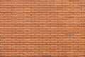 Horizontal part of orange brick masonry wall Royalty Free Stock Photo