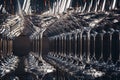 Horizontal photo of aligned empty wine glasses, close up, black and white. Selective focus.