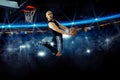 Horizontal photo of basketball player in the game makes reverse Royalty Free Stock Photo